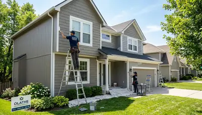 Professional house painters working on residential interior walls in Overland Park, KS